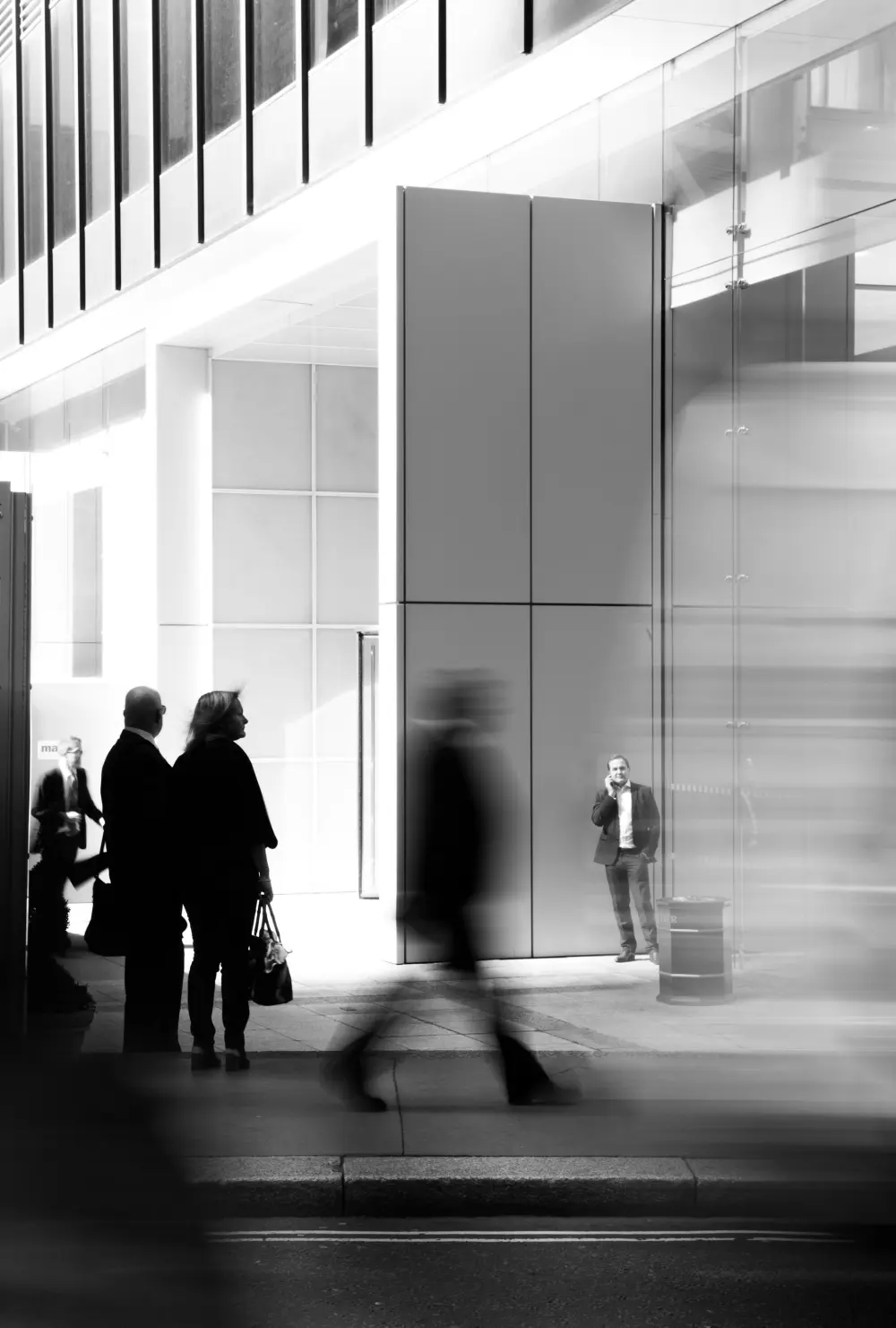 Professionals moving through modern architecture